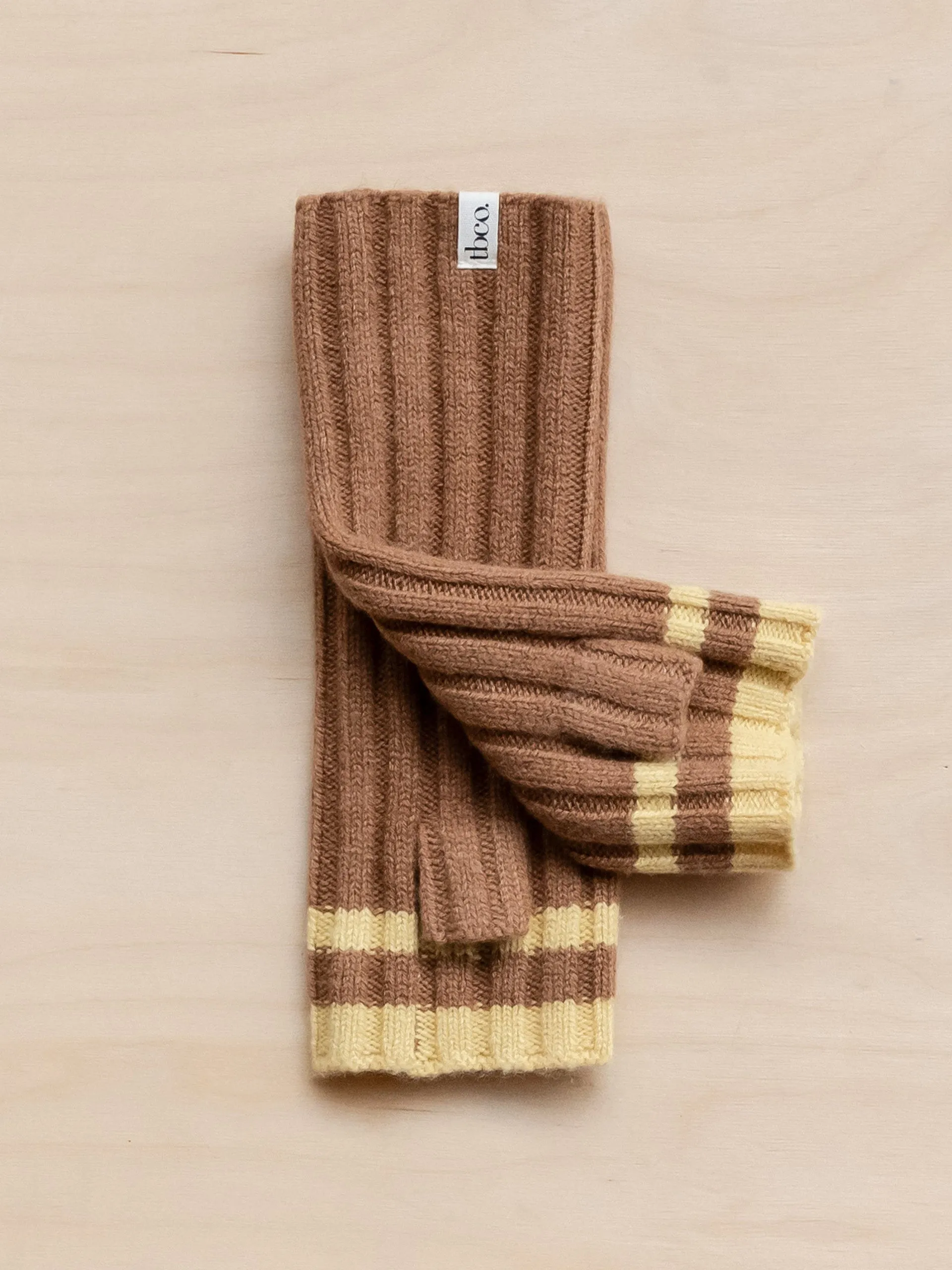 Cashmere and merino wrist warmers in camel and vanilla