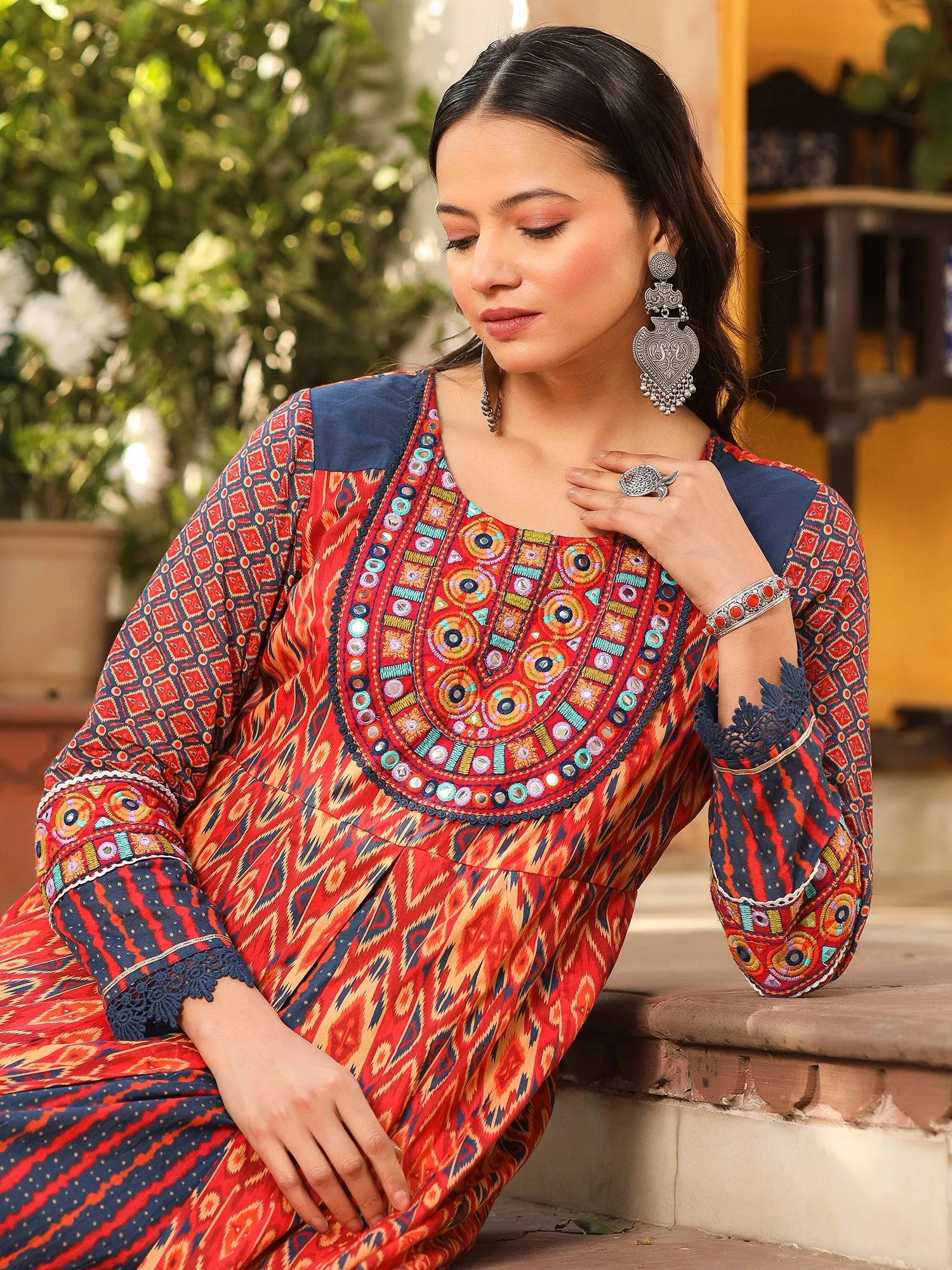 Jashvi Rust Cotton Ikat Printed Layered Maxi Dress With Thread Embroidery & Dori Tassel Tie-Up At Waist