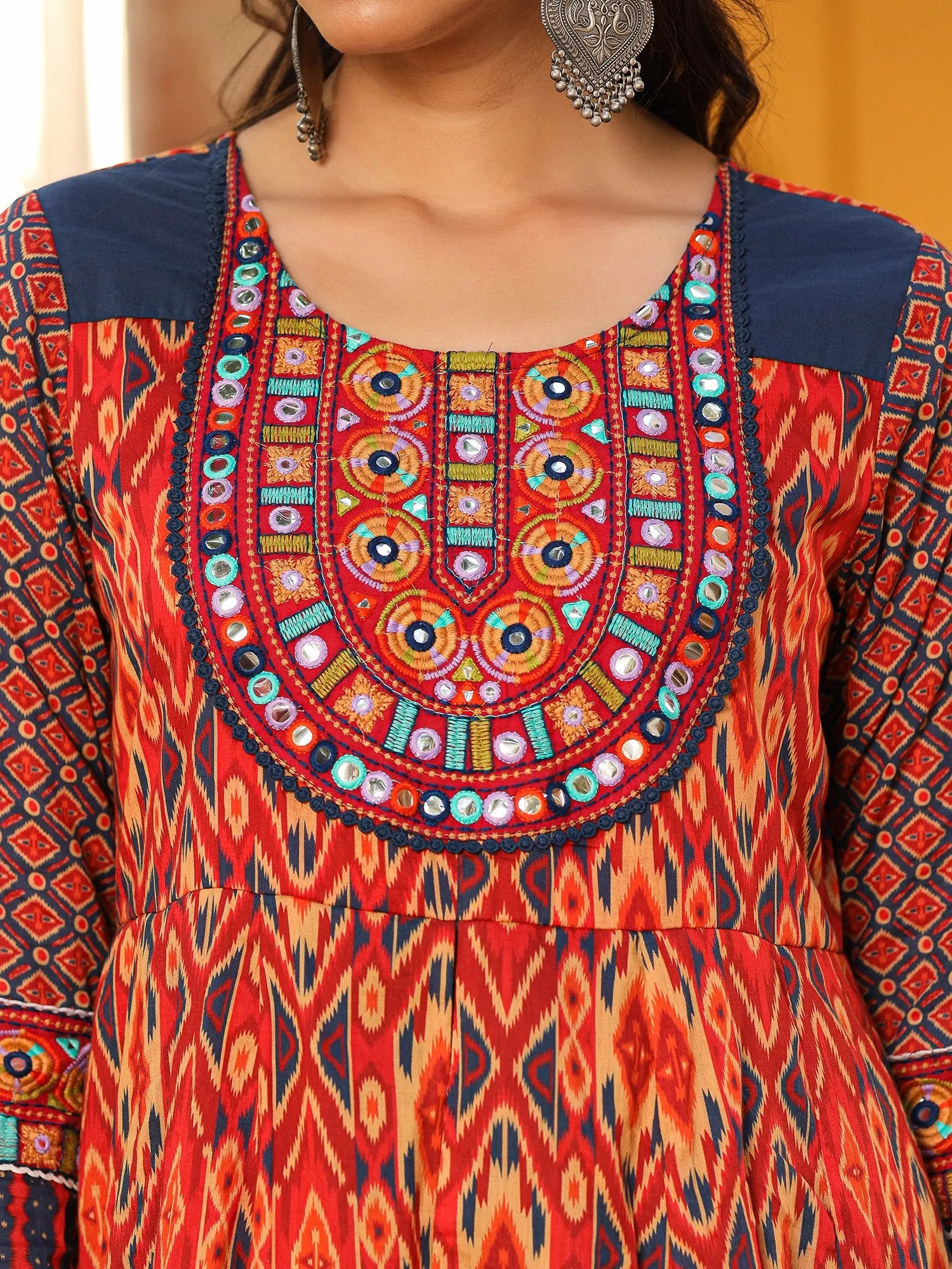 Jashvi Rust Cotton Ikat Printed Layered Maxi Dress With Thread Embroidery & Dori Tassel Tie-Up At Waist